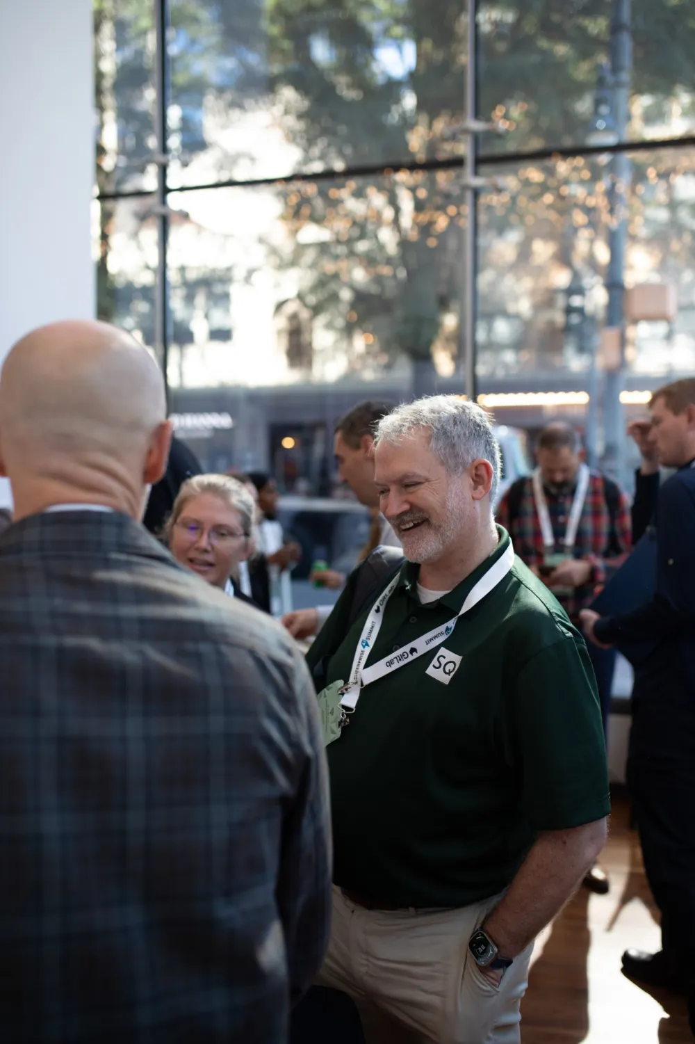 Attendees laughing together between sessions