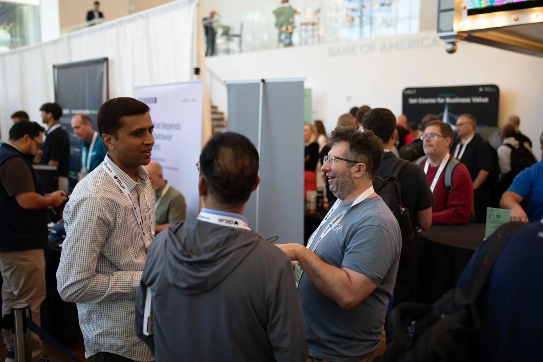 Attendees in conversation in the sponsor hall